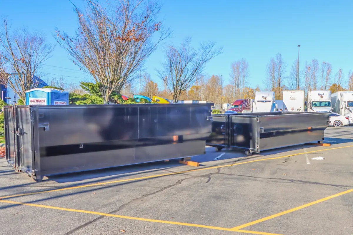 Professional dumpster rental service with roll-off container on residential driveway in Azusa